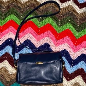 Stylish navy blue Tandem crossbody bag.